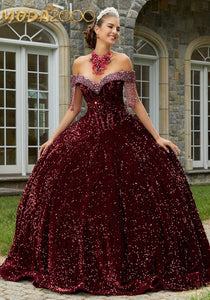 M2K89455| Shimmering ball gown in patterned glitter tulle has a subtly –  Moda 2000 LLC